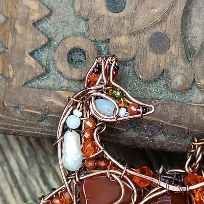 Foxy the swoopy tail! Copper necklace with carnelians.