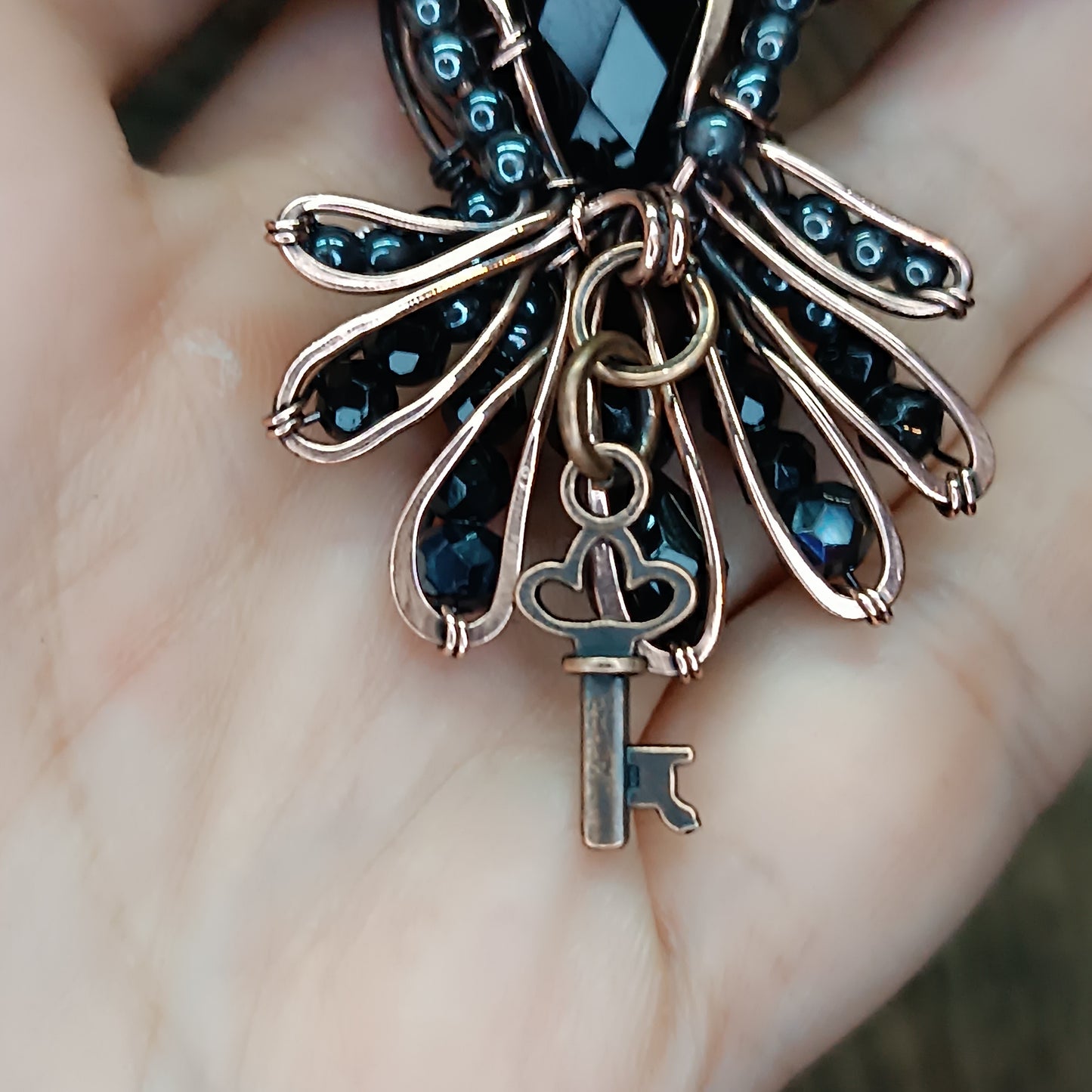 Secret keeper. Raven necklace with open wings.