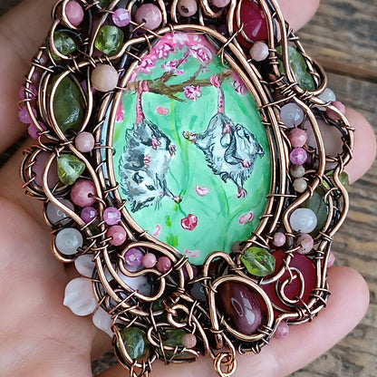 Charming possums and cherry blossom. Wire wrapped 2 sided necklace with miniature paintings