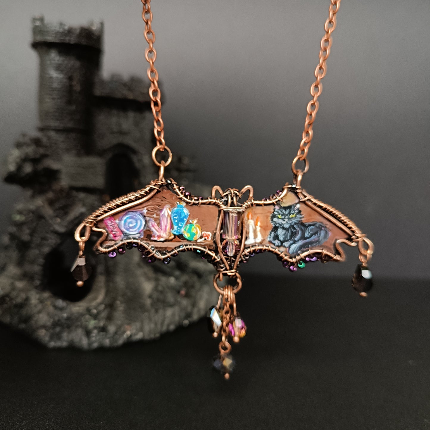 Halloween story. Painted bat necklace