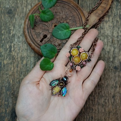 Honey bee pollinating in the rose garden. Necklace.