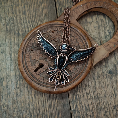 Secret keeper. Raven necklace with open wings.