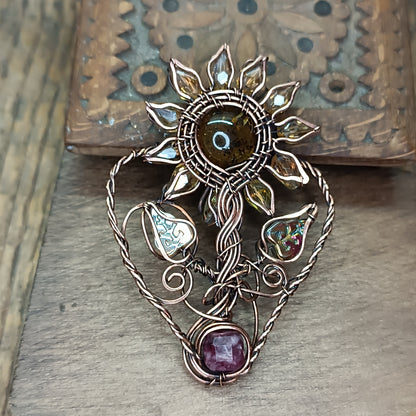 Sunflower pendant with garnet root