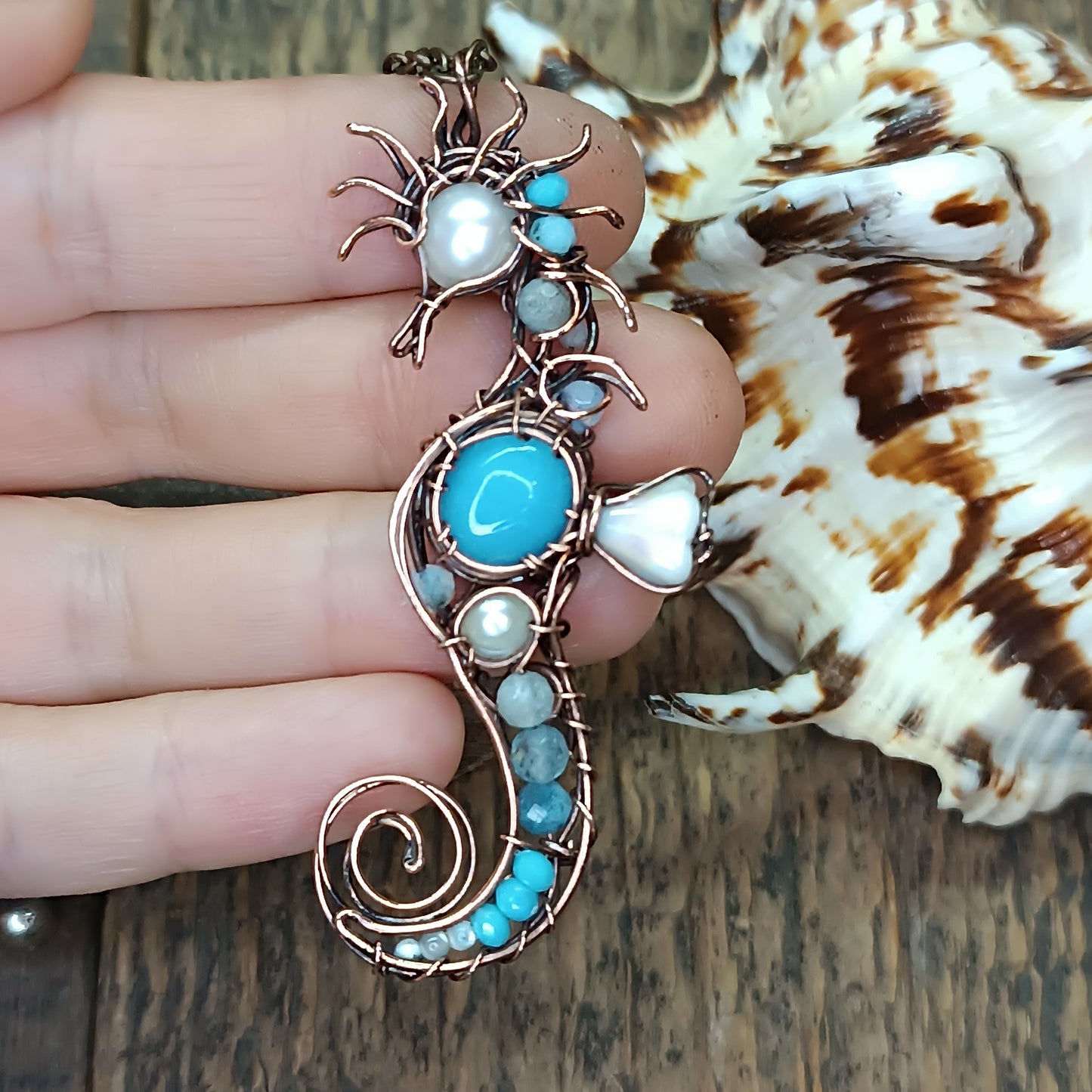 Blue and white seahorse pendant
