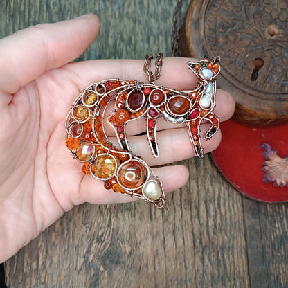 Swoopy tail Foxy. Sparkly wire wrapped pendant.