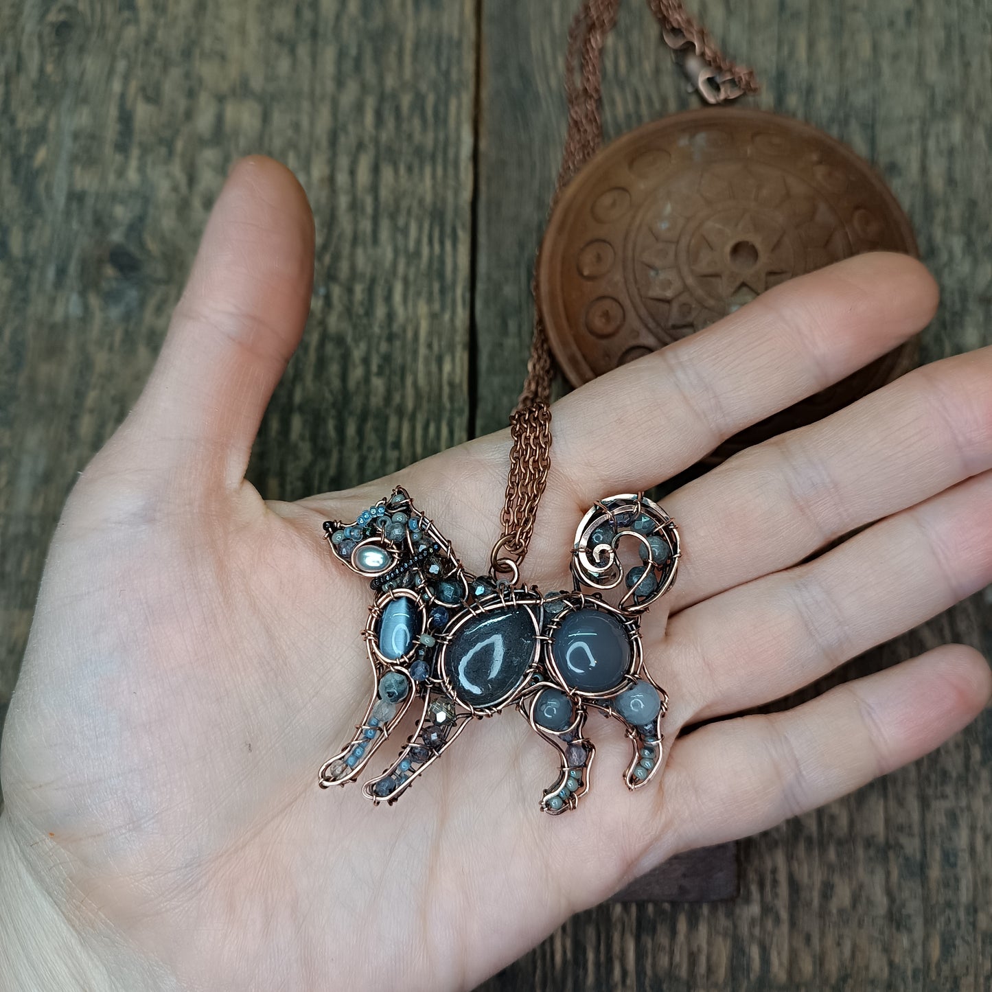 Sweet puppy. Detailed wire wrapped and beaded pendant.