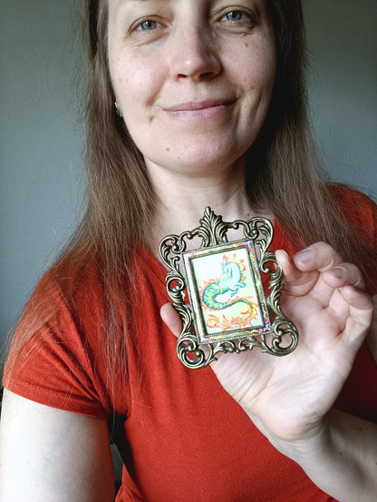 Magic unicorn. Miniature watercolour painting in a frame.