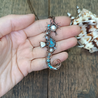 Blue and white seahorse pendant