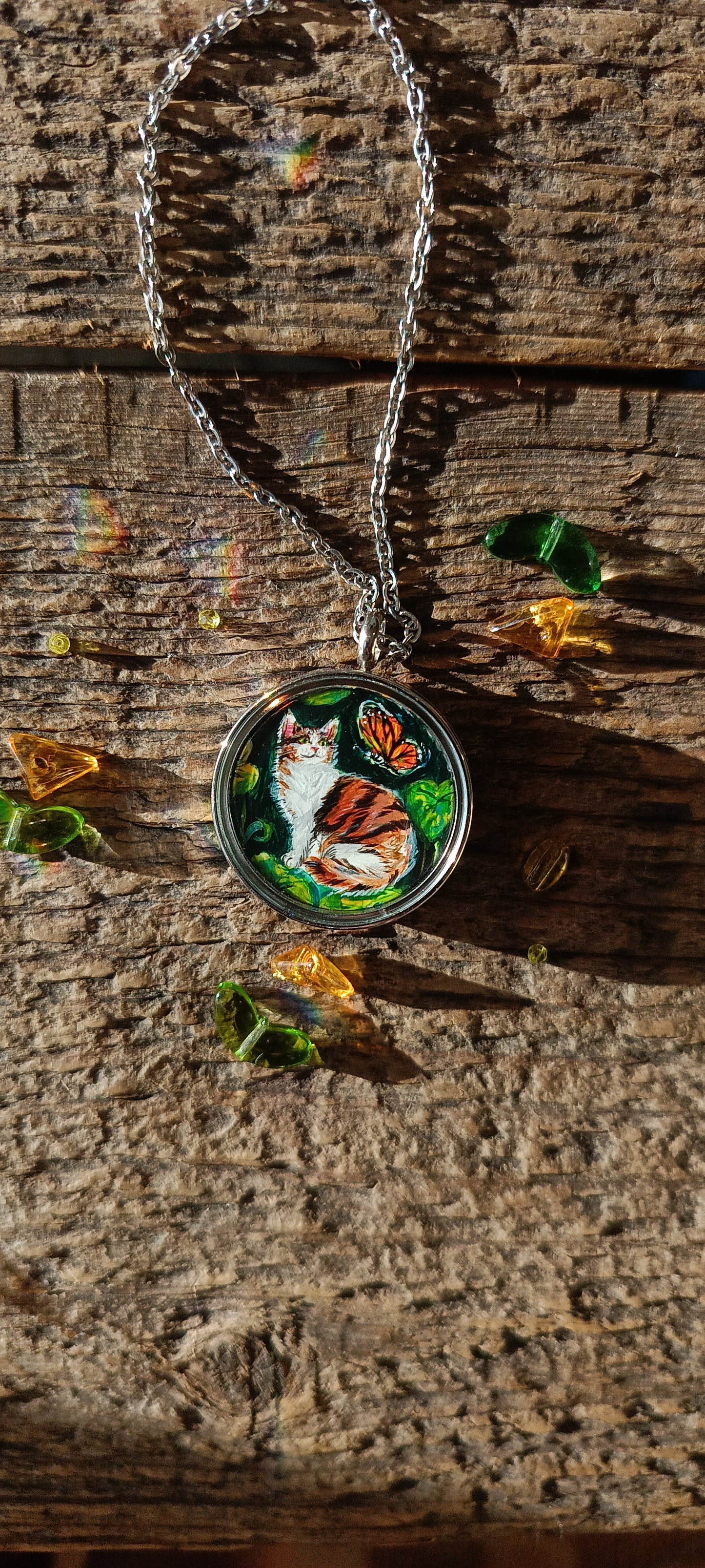 Cat admiring butterflies. Pendant.