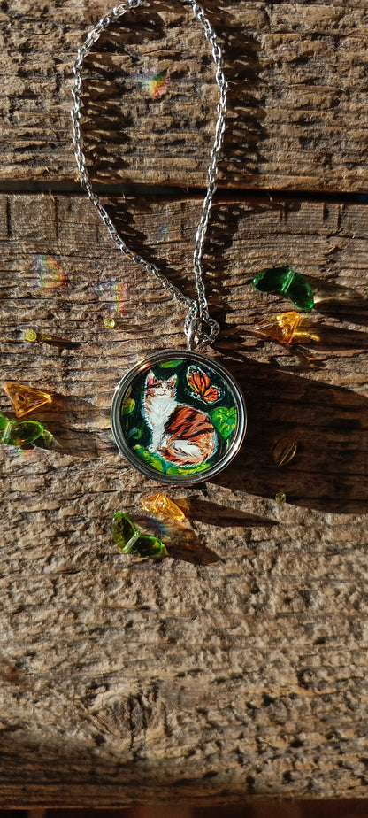 Cat admiring butterflies. Pendant.
