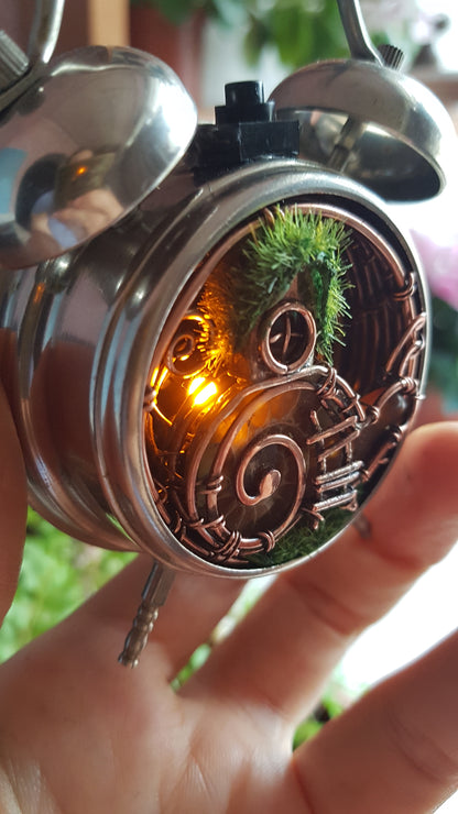 Snail fairy house. Mini world in a clock. Steampunk decor with light.