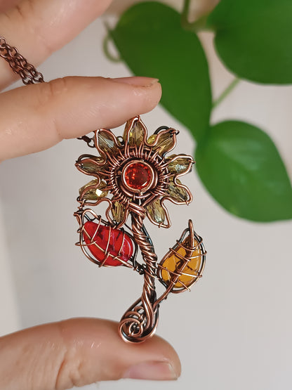 Sunflower pendant with red leaf