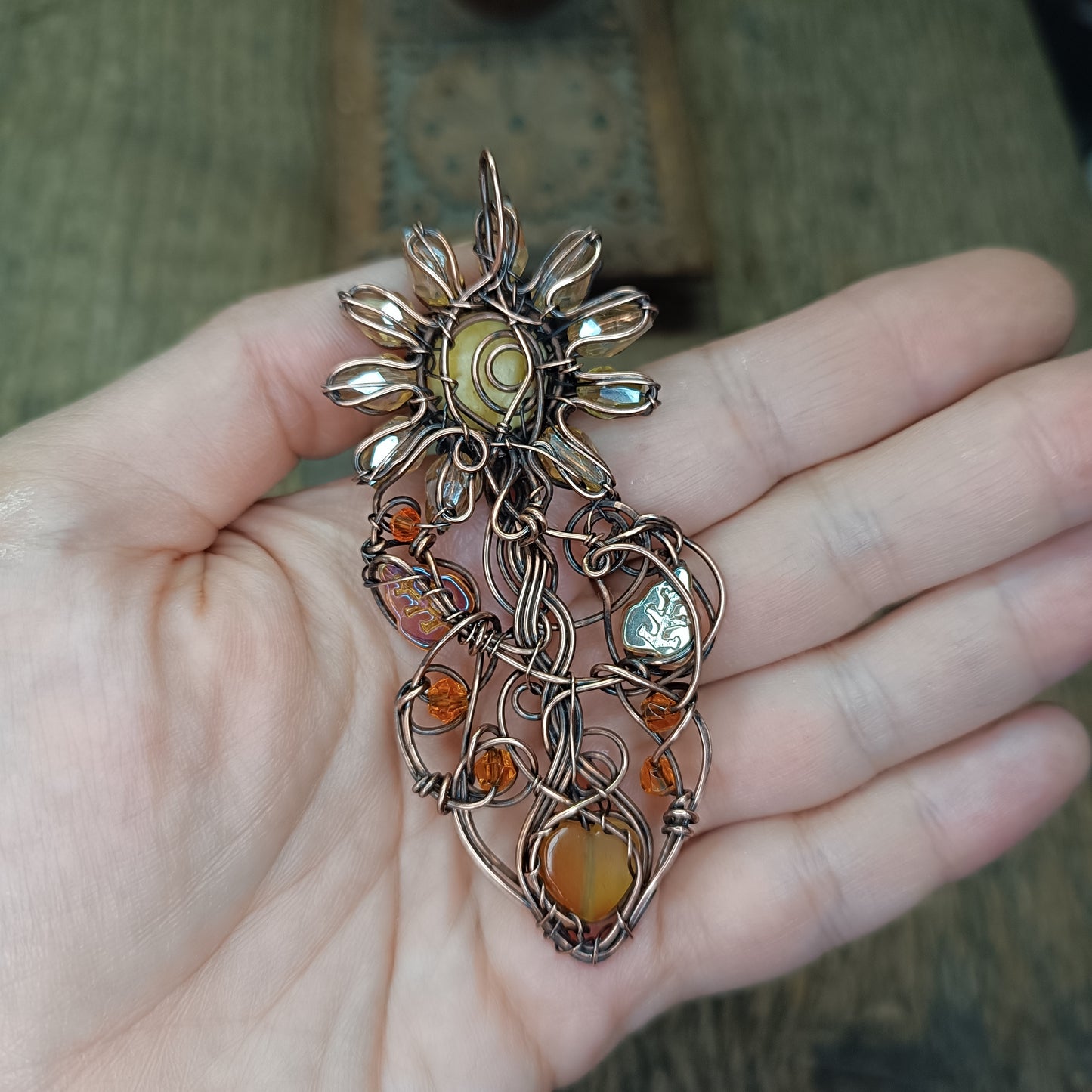 Sunflower pendant with carnelian heart root