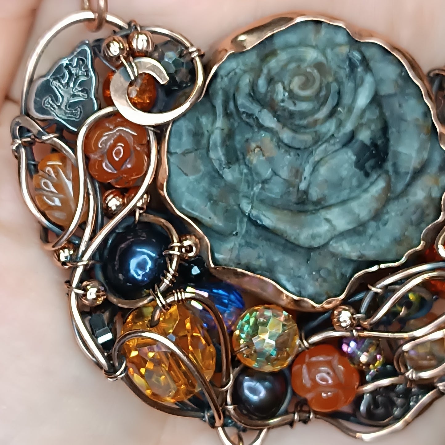 Hidden fire. Rose necklace.