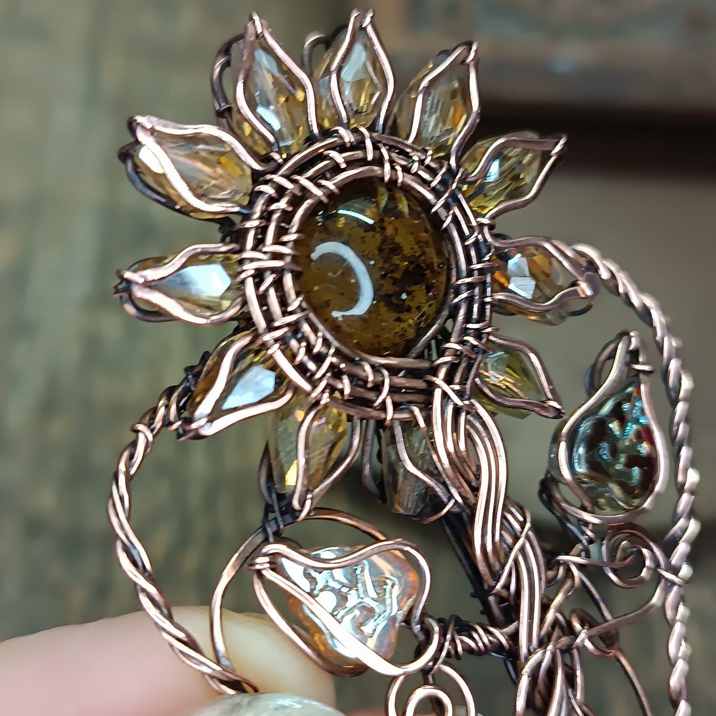 Sunflower pendant with garnet root