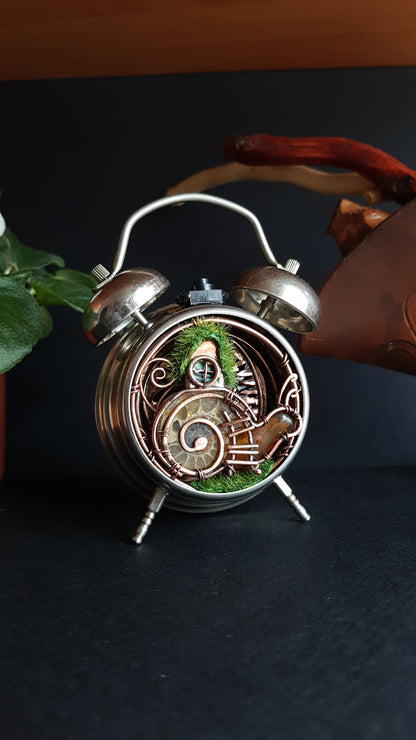 Snail fairy house. Mini world in a clock. Steampunk decor with light.