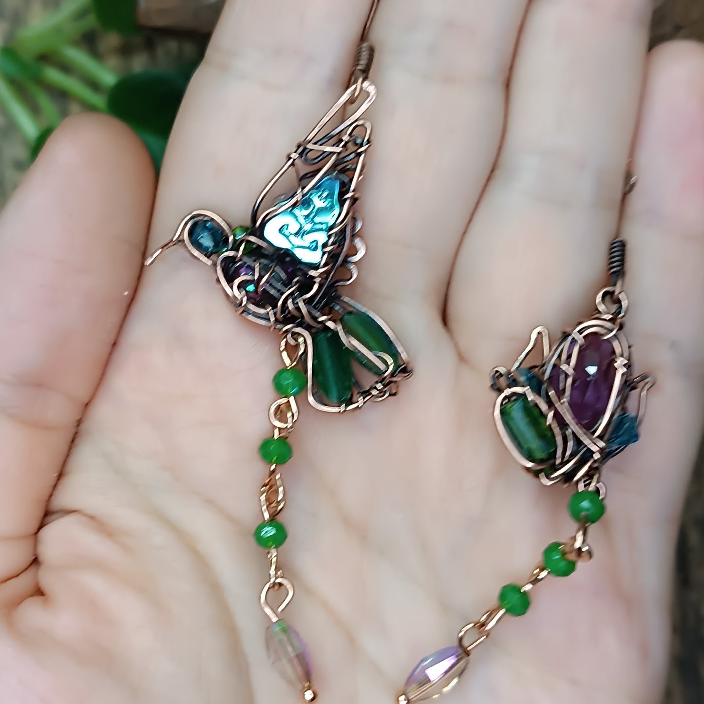 Humming bird and flower dangling earrings.