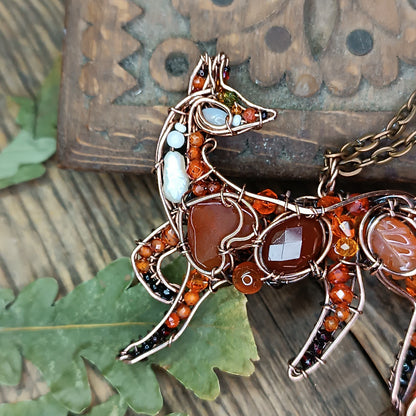 Foxy the swoopy tail! Copper necklace with carnelians.