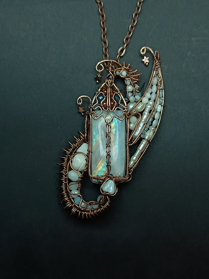 The ballad of the Pearl Dragon and the Moonstone Castle. Wire wrapped necklace