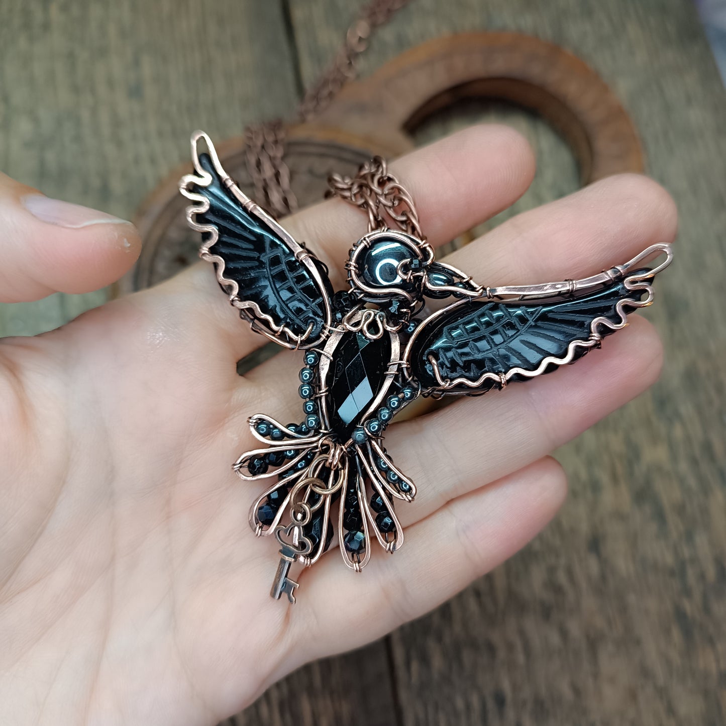 Secret keeper. Raven necklace with open wings.