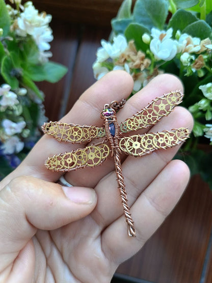 Dragonfly pendant with cogs.