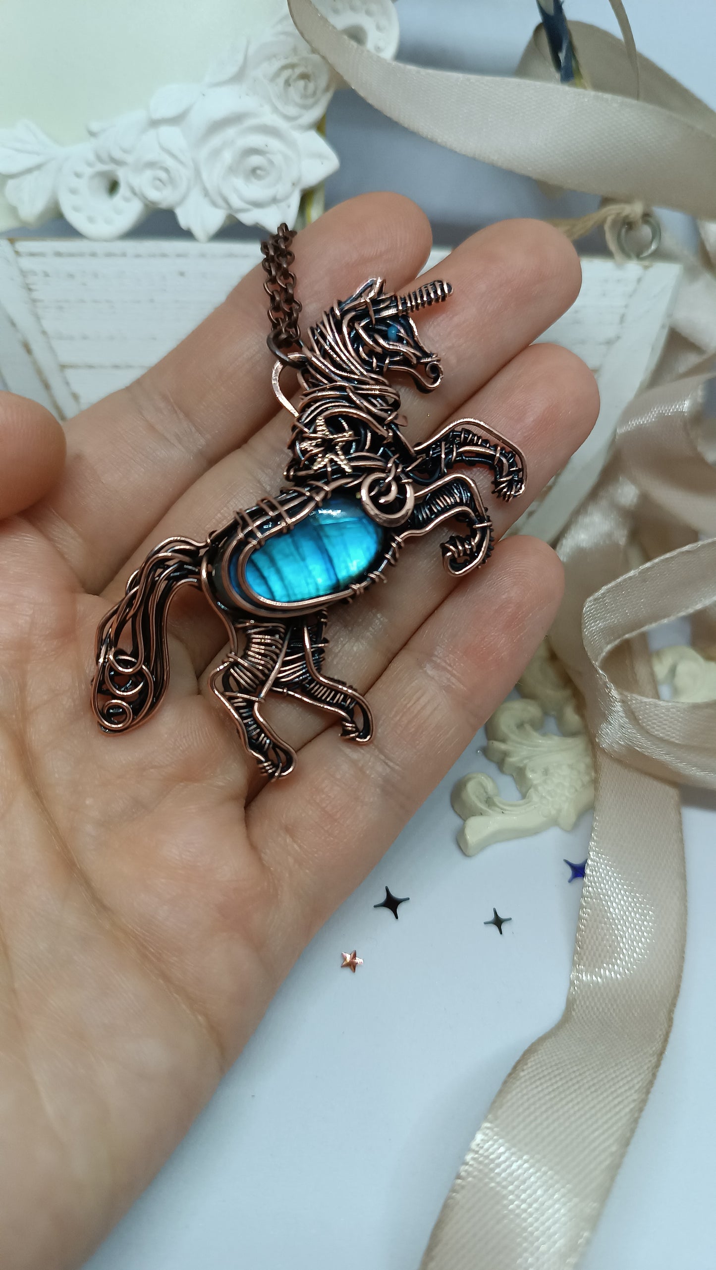 Unicorn and the falling star. Copper pendant with labradorites.