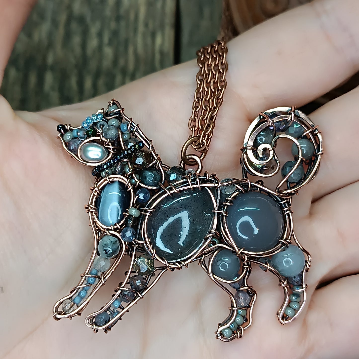 Sweet puppy. Detailed wire wrapped and beaded pendant.