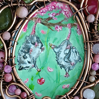 Charming possums and cherry blossom. Wire wrapped 2 sided necklace with miniature paintings
