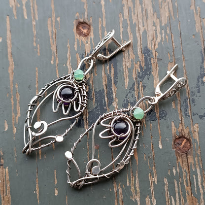 Silver dangling earrings. Amethyst bells.