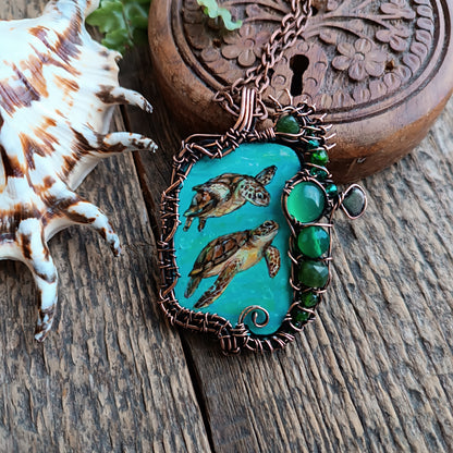 Aquatic adventure 🐢🦦 Hand painted wire wrapped necklace. 2 sided.