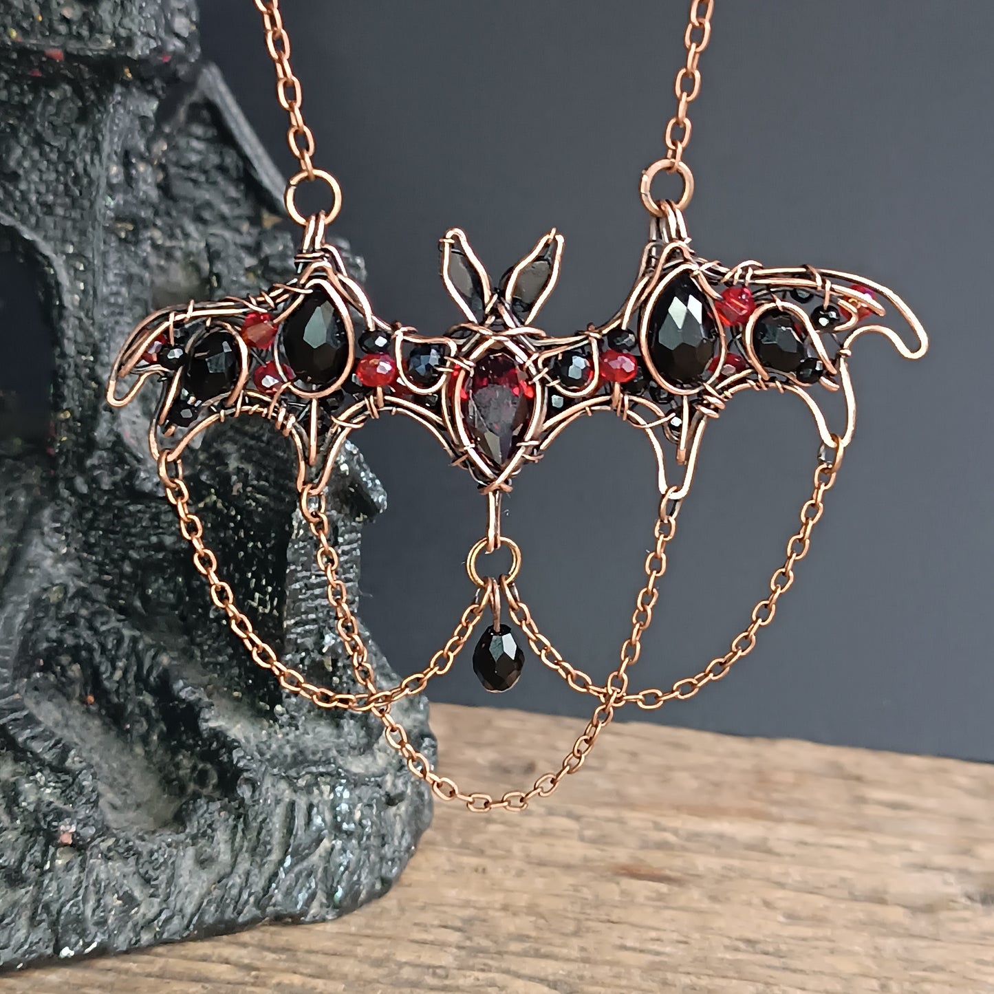 Scarlet dance. Bat necklace.
