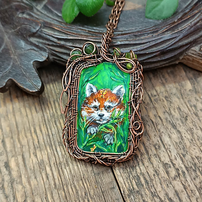 Red panda and a butterfly necklace. Reversible.