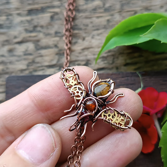 Small golden cogs wings bee charm.