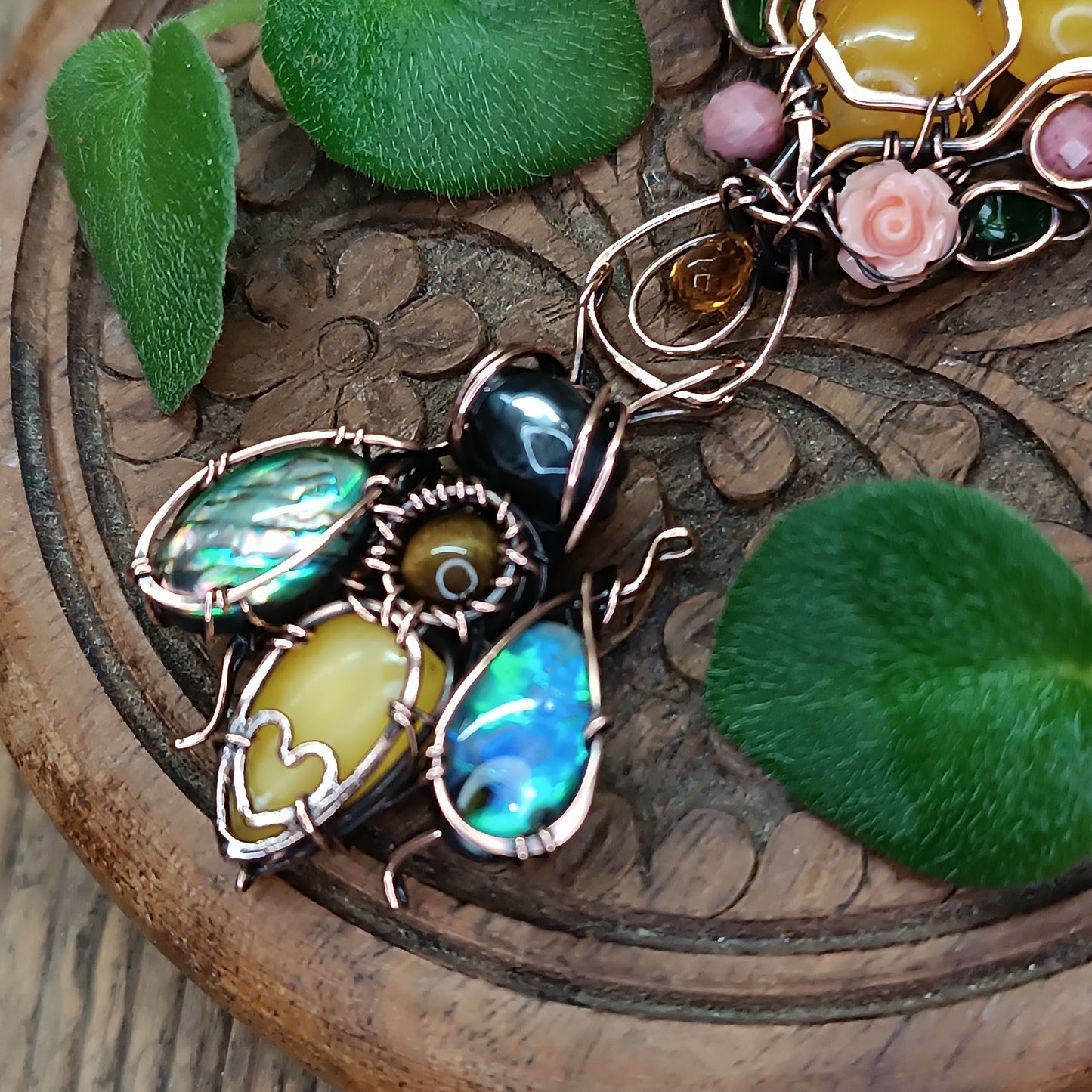 Honey bee pollinating in the rose garden. Necklace.