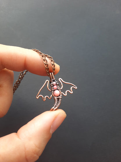 Tiny pink coral dragon pendant