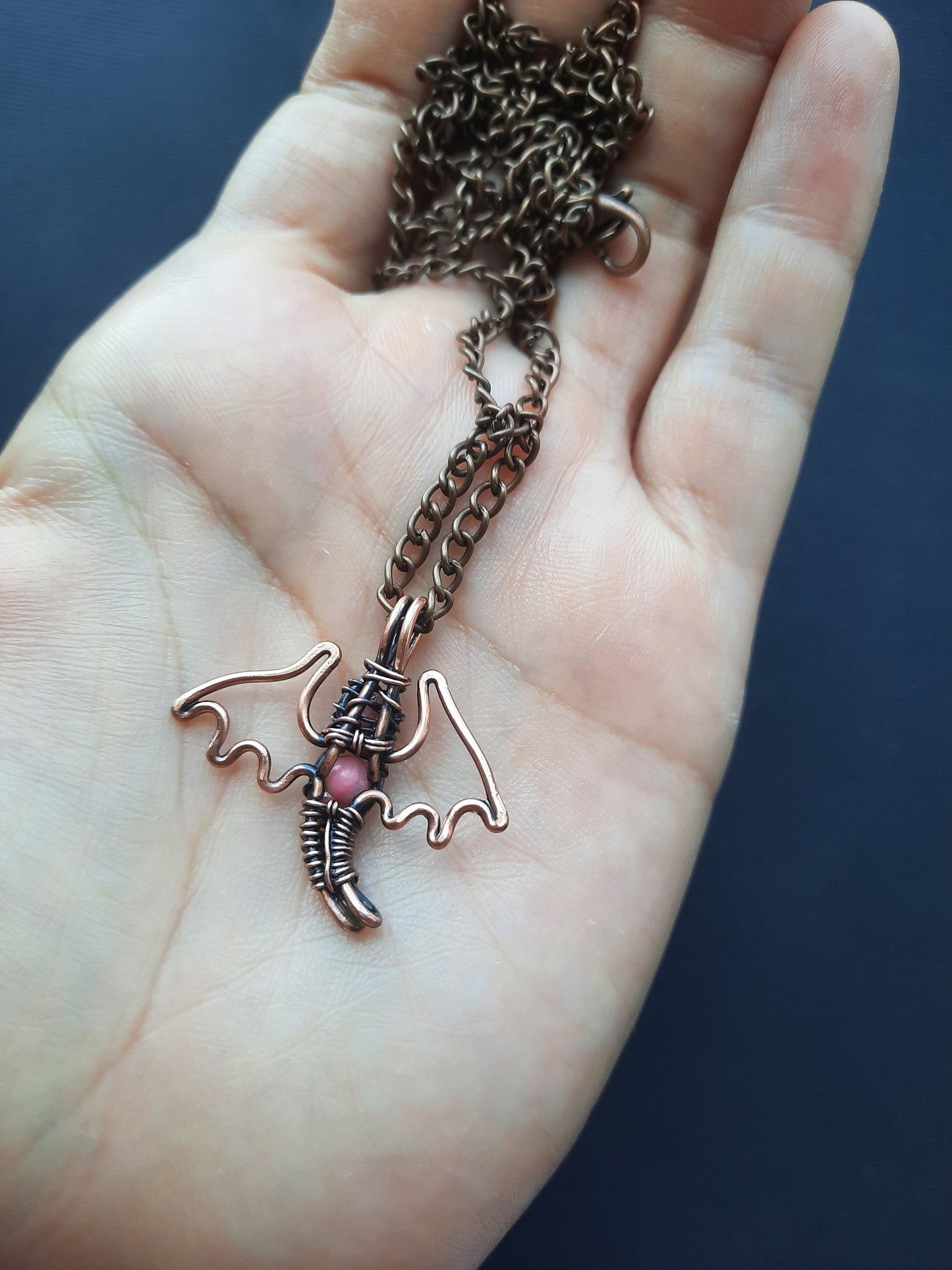 Tiny pink coral dragon pendant