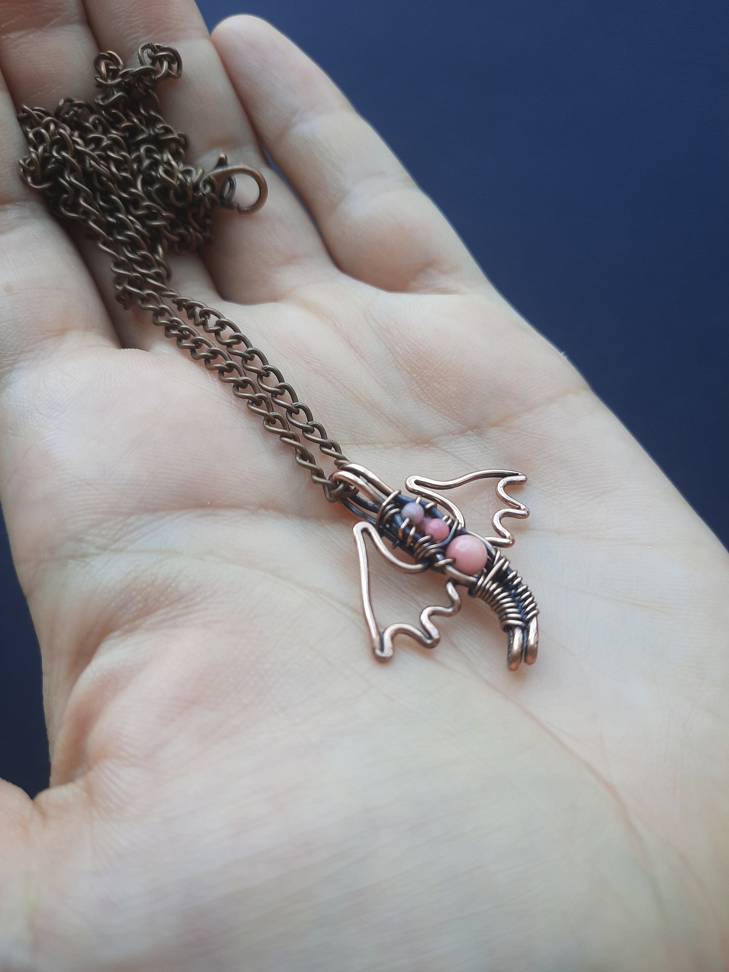 Tiny pink coral dragon pendant